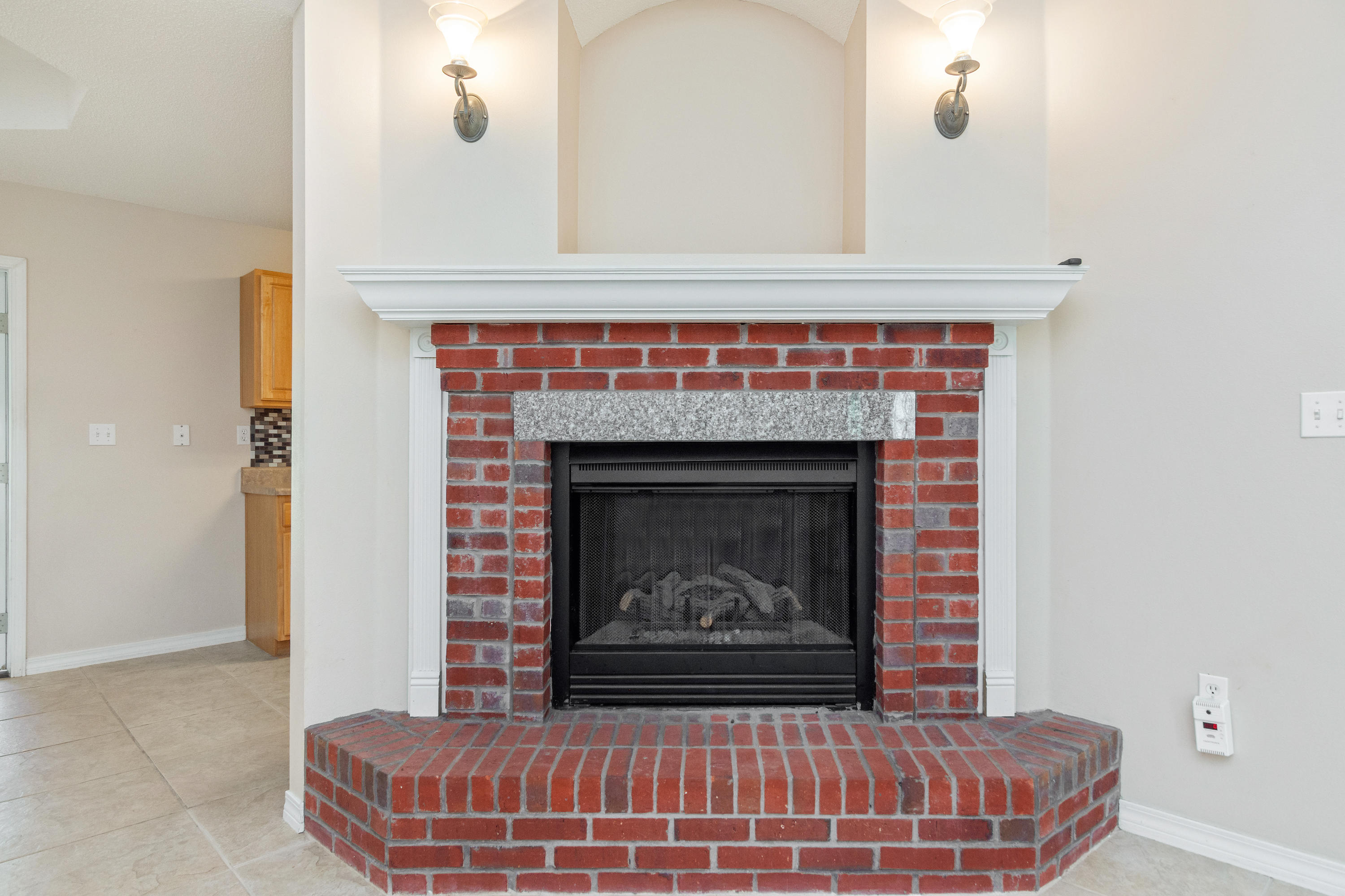 3811 Poverty Creek Road Crestview, FL 32539 - Photo 9 of 48 a room with fireplace and a fireplace