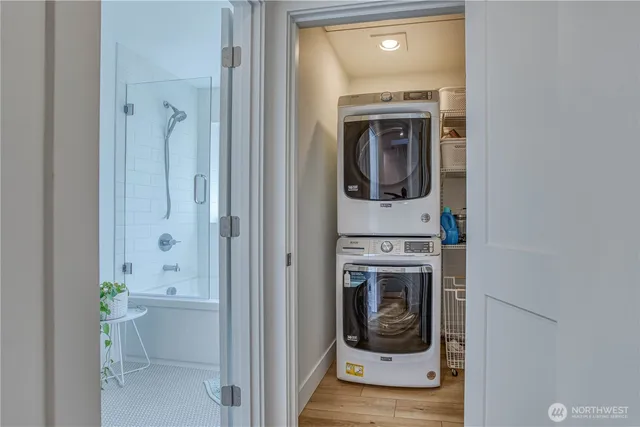 a view of a hallway with washer and dryer