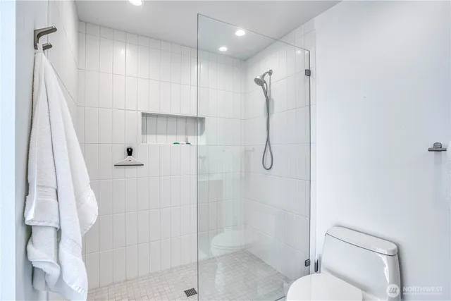 a bathroom with a shower toilet and sink