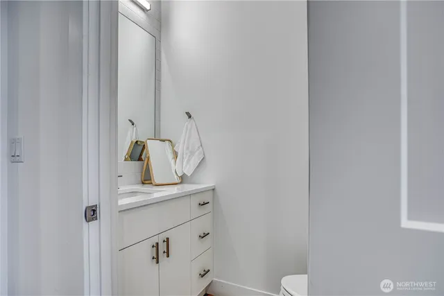 a close view of a sink and a mirror in bathroom