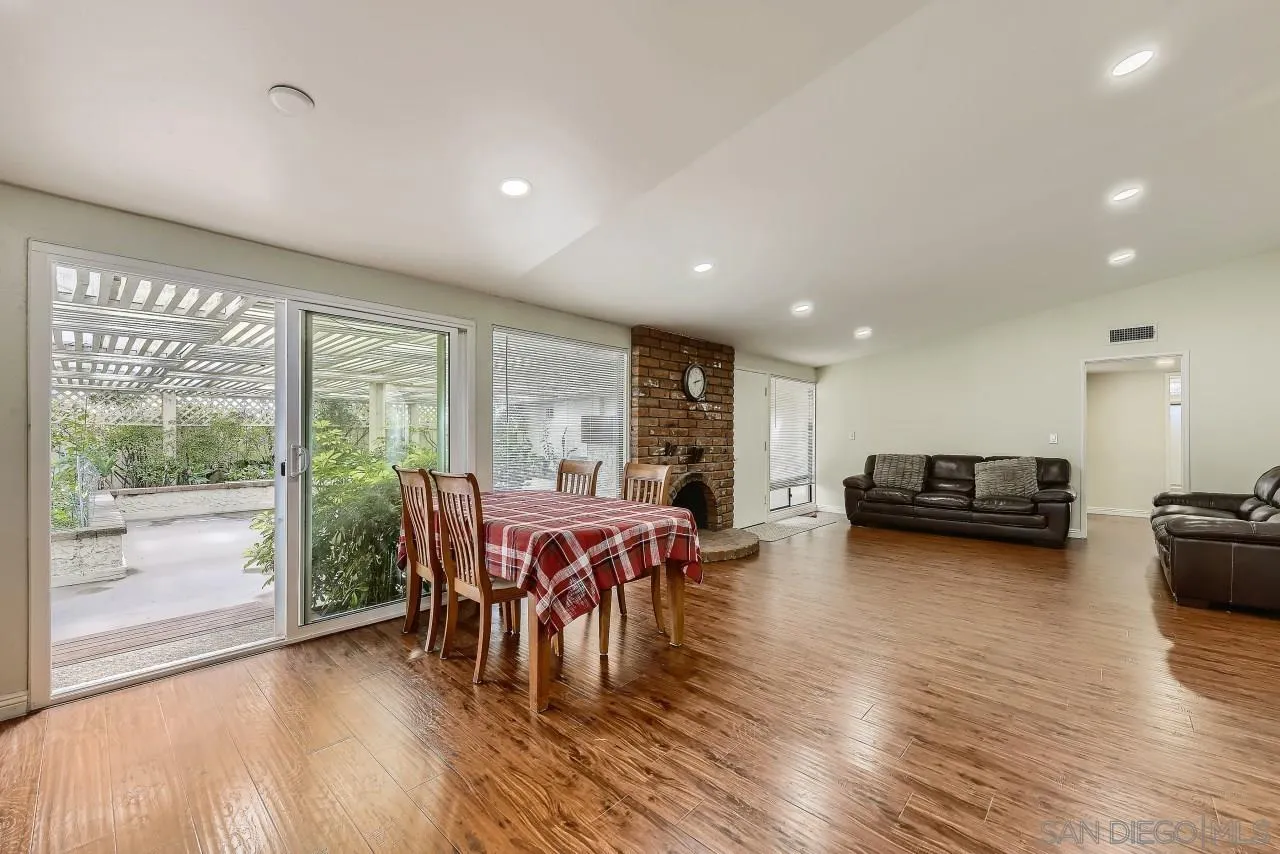 13847 Tobiasson Road Poway, CA 92064 - Photo 11 of 28 a view of a dining room with furniture window and wooden floor