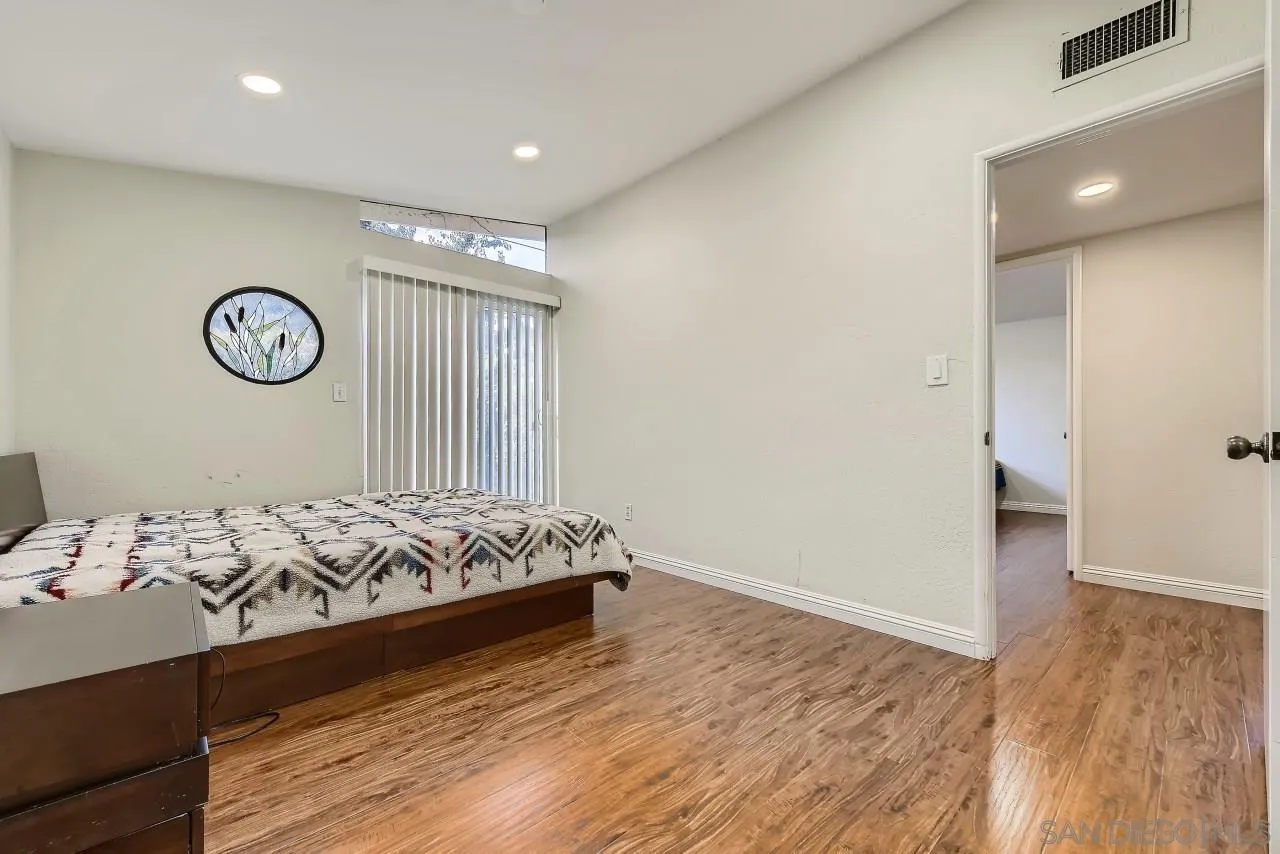 13847 Tobiasson Road Poway, CA 92064 - Photo 13 of 28 a bedroom with a bed and a window