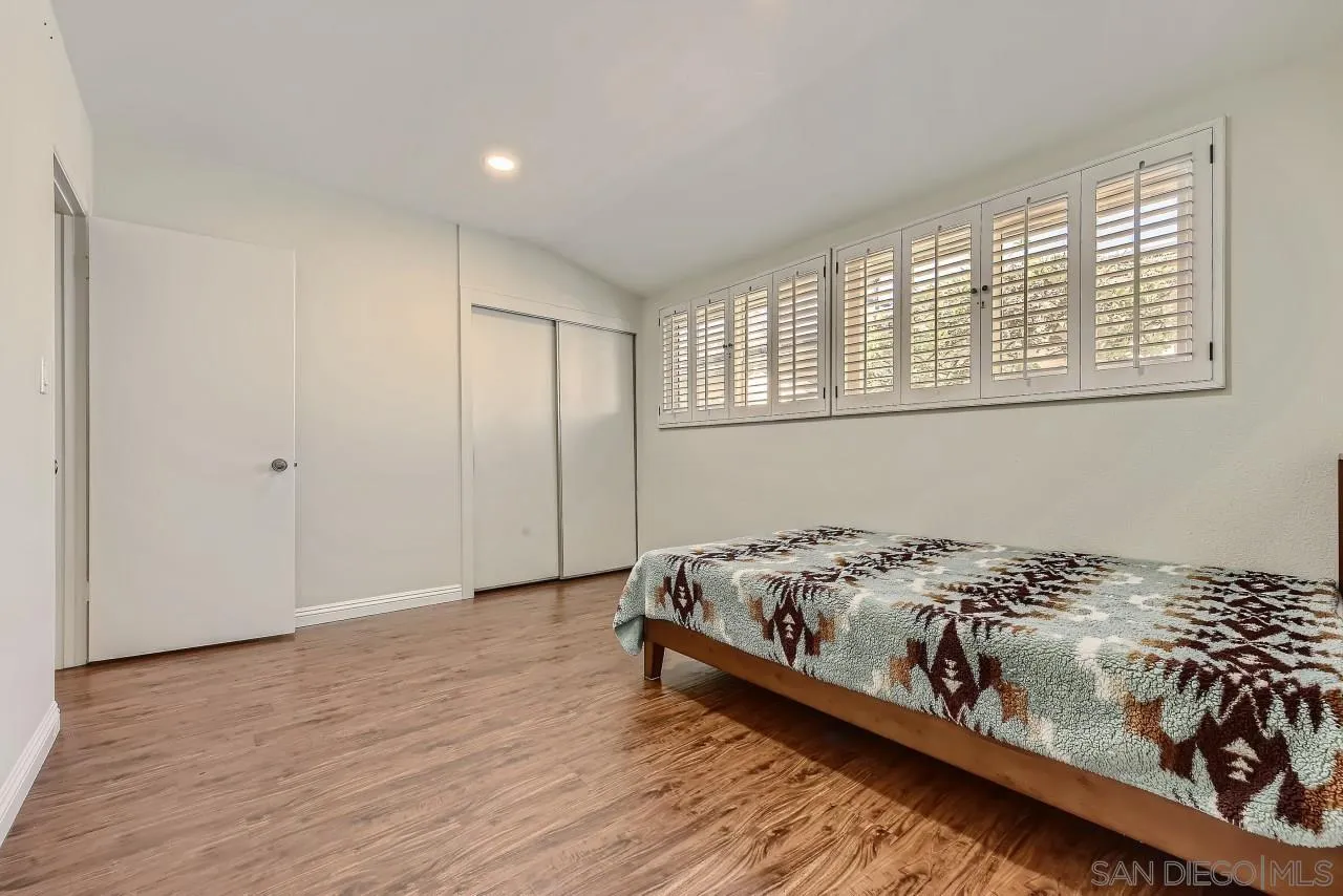 13847 Tobiasson Road Poway, CA 92064 - Photo 14 of 28 a bed sitting in a bedroom next to a window