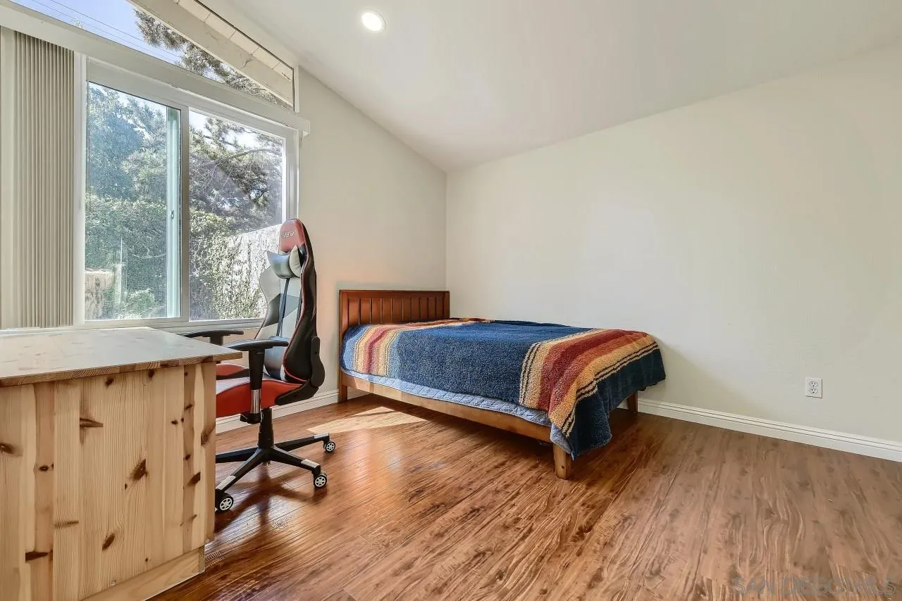 13847 Tobiasson Road Poway, CA 92064 - Photo 16 of 28 a bedroom with a bed and a window