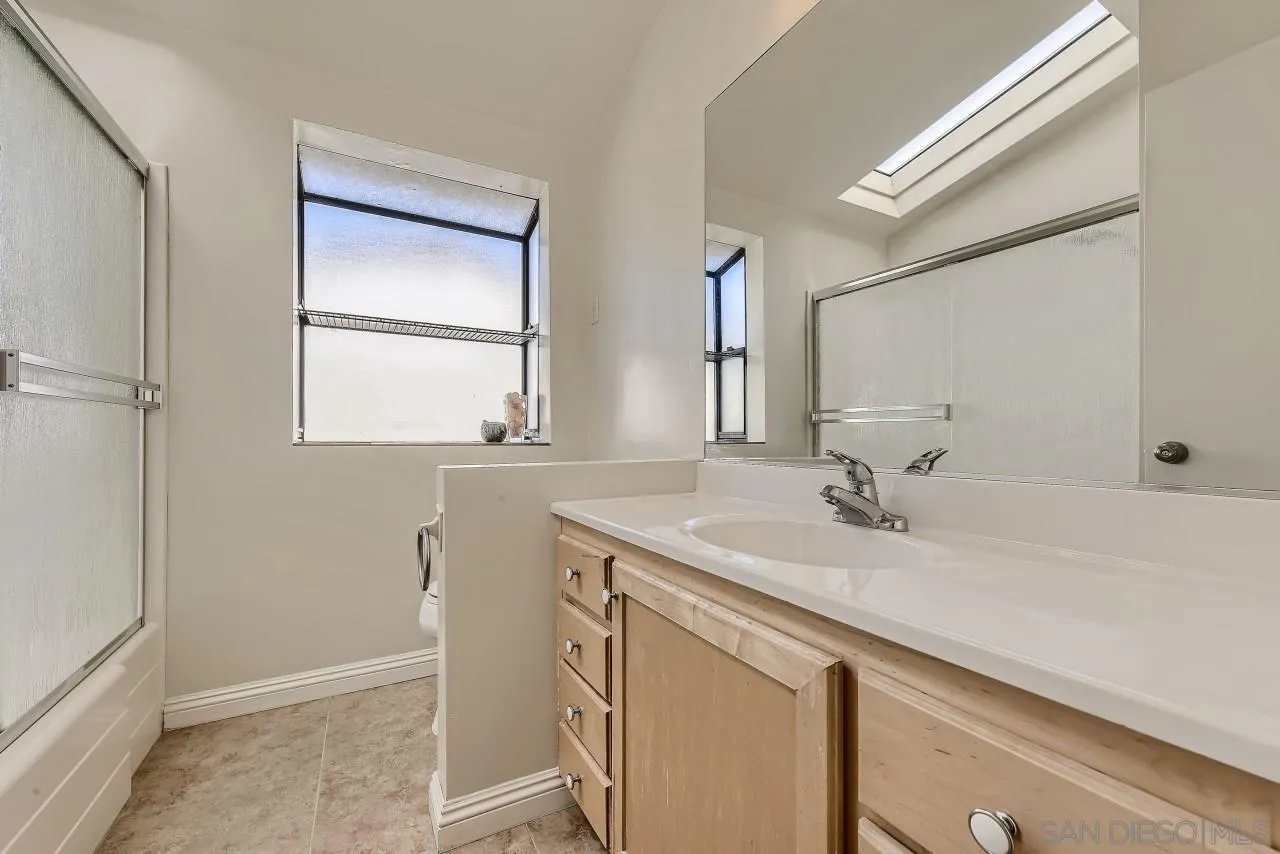 13847 Tobiasson Road Poway, CA 92064 - Photo 21 of 28 a bathroom with a sink and a mirror
