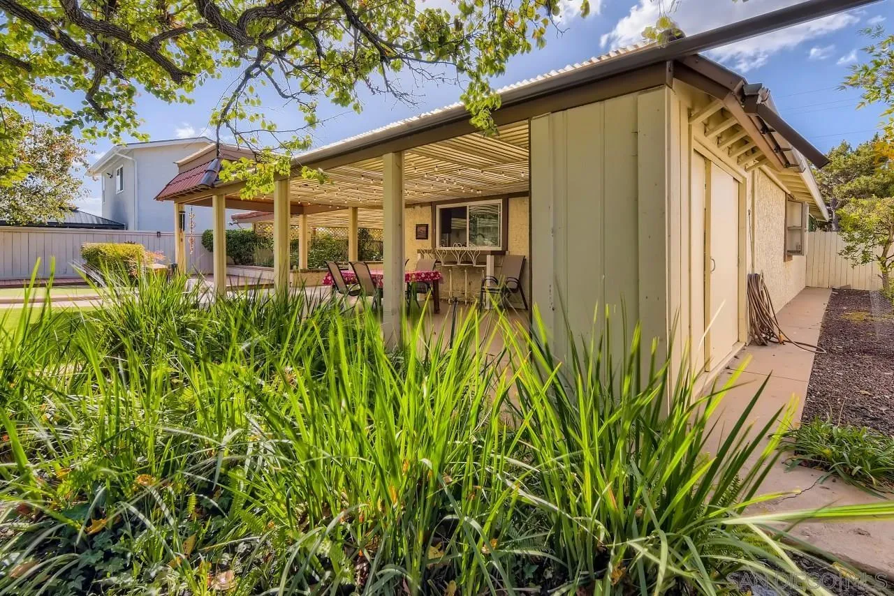 13847 Tobiasson Road Poway, CA 92064 - Photo 24 of 28 a view of a house with a small yard and plants