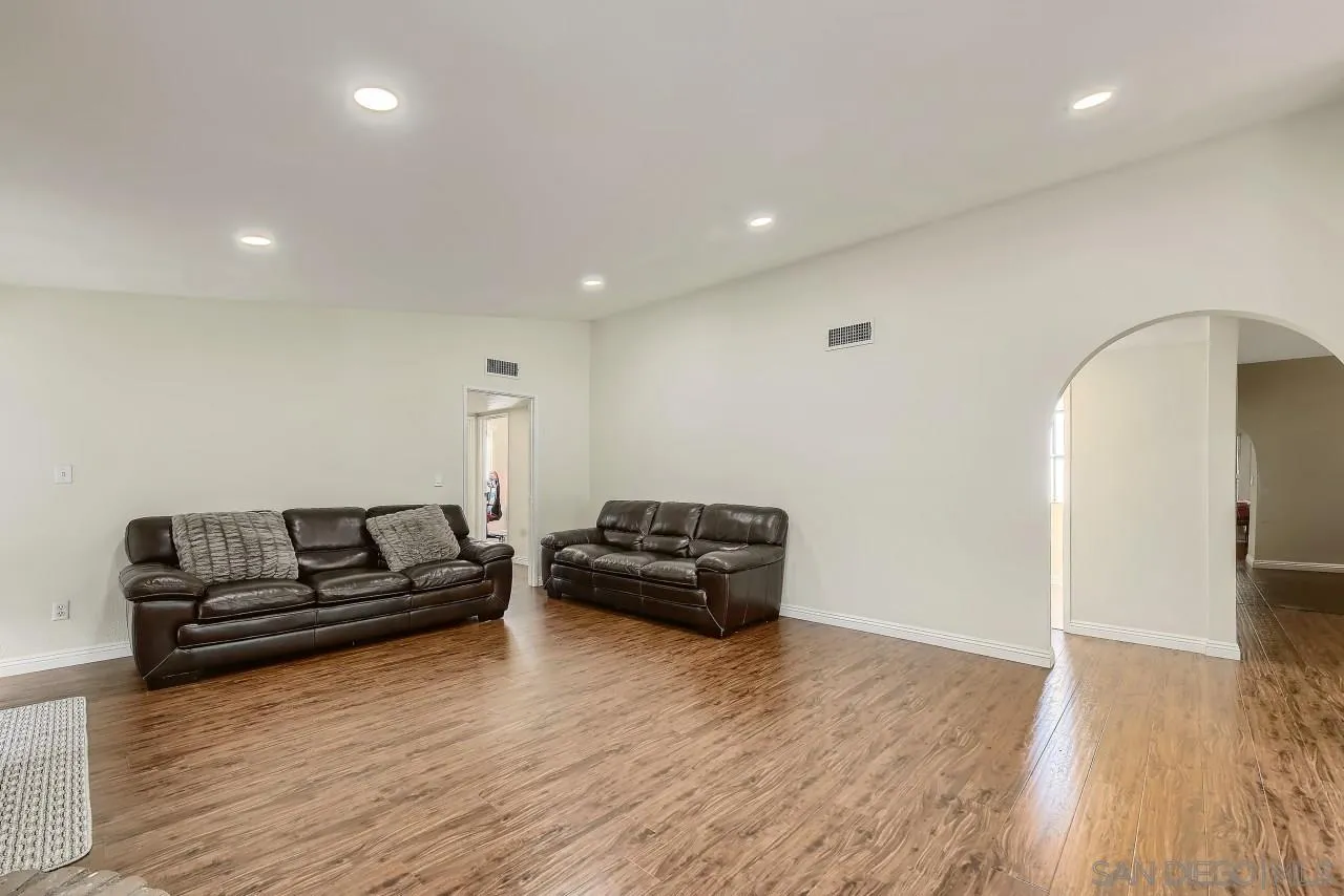 13847 Tobiasson Road Poway, CA 92064 - Photo 4 of 28 a living room with furniture and wooden floor
