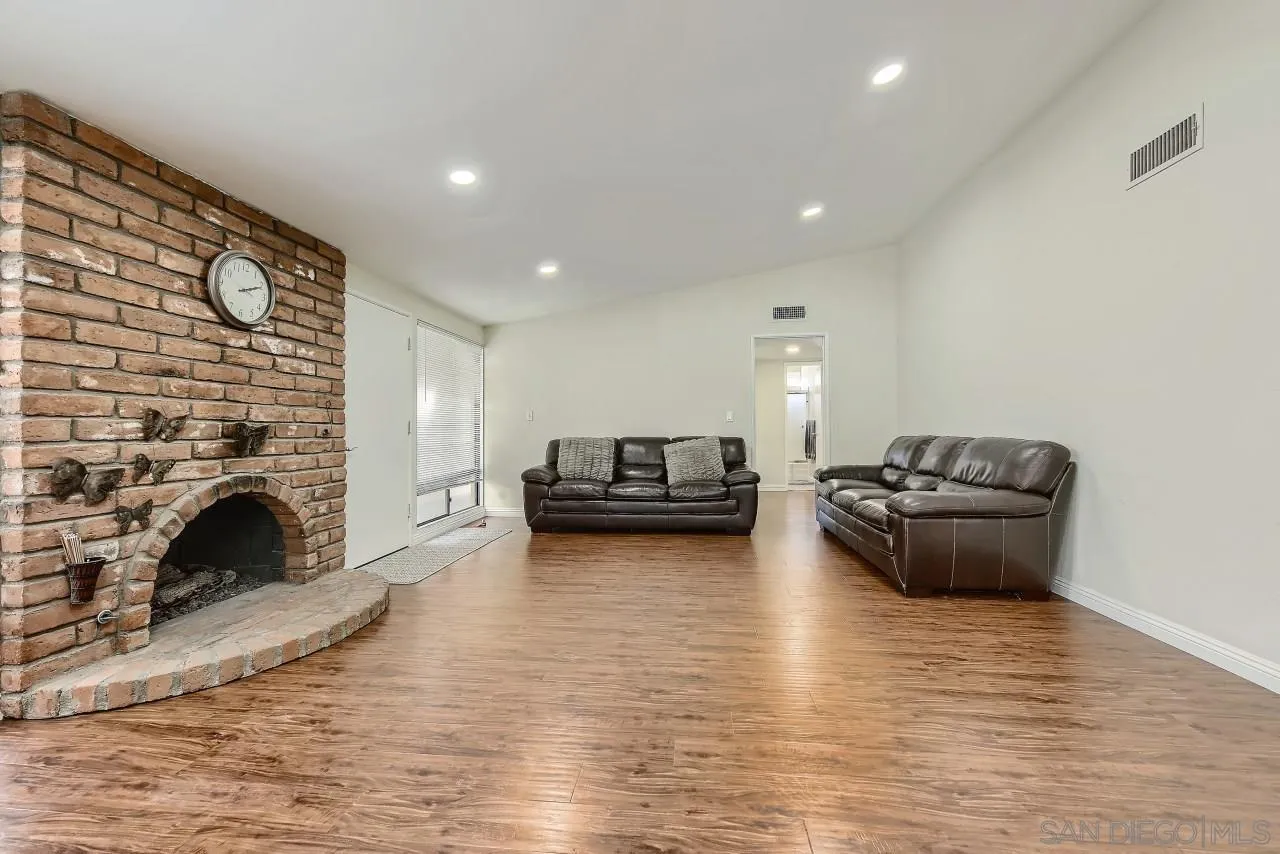 13847 Tobiasson Road Poway, CA 92064 - Photo 5 of 28 a living room with furniture and a fireplace