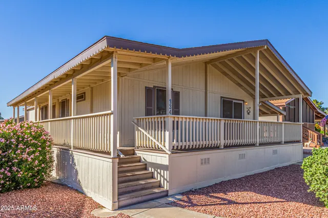 a view of a house with a small yard
