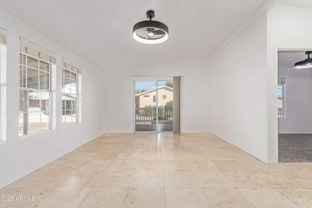 a view of an empty room with a window