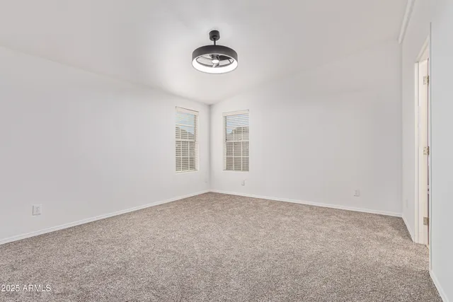 an empty room with a empty space and a window