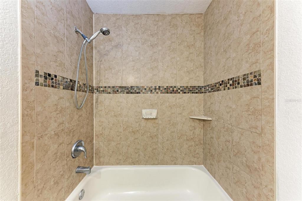 3411 Clark Road, Unit 212 Sarasota, FL 34231 - Photo 18 of 20 a bathroom with a shower
