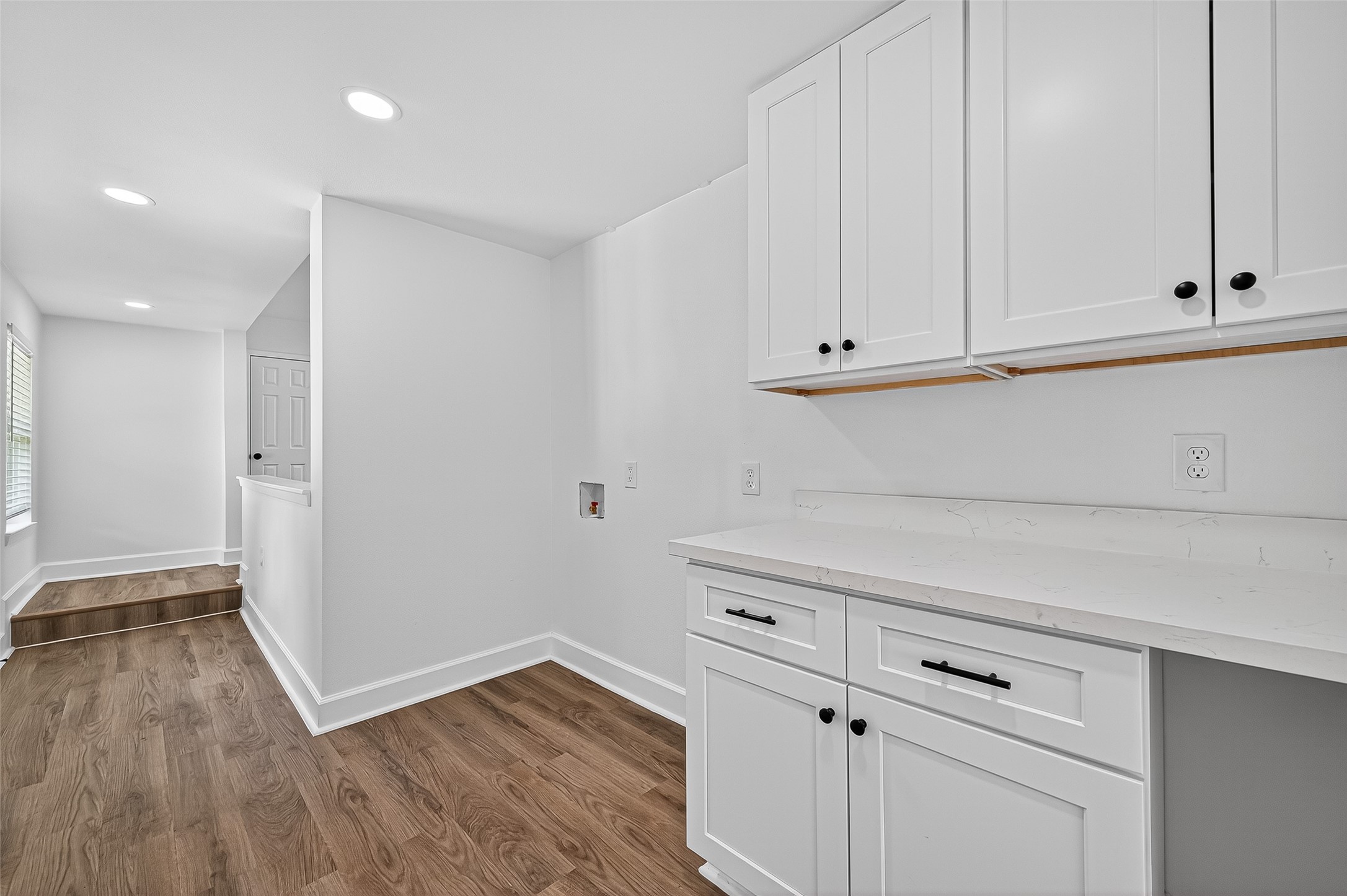 1609 North Pacific Street Conroe, TX 77301 - Photo 14 of 28 a view of kitchen with wooden floor and cabinets