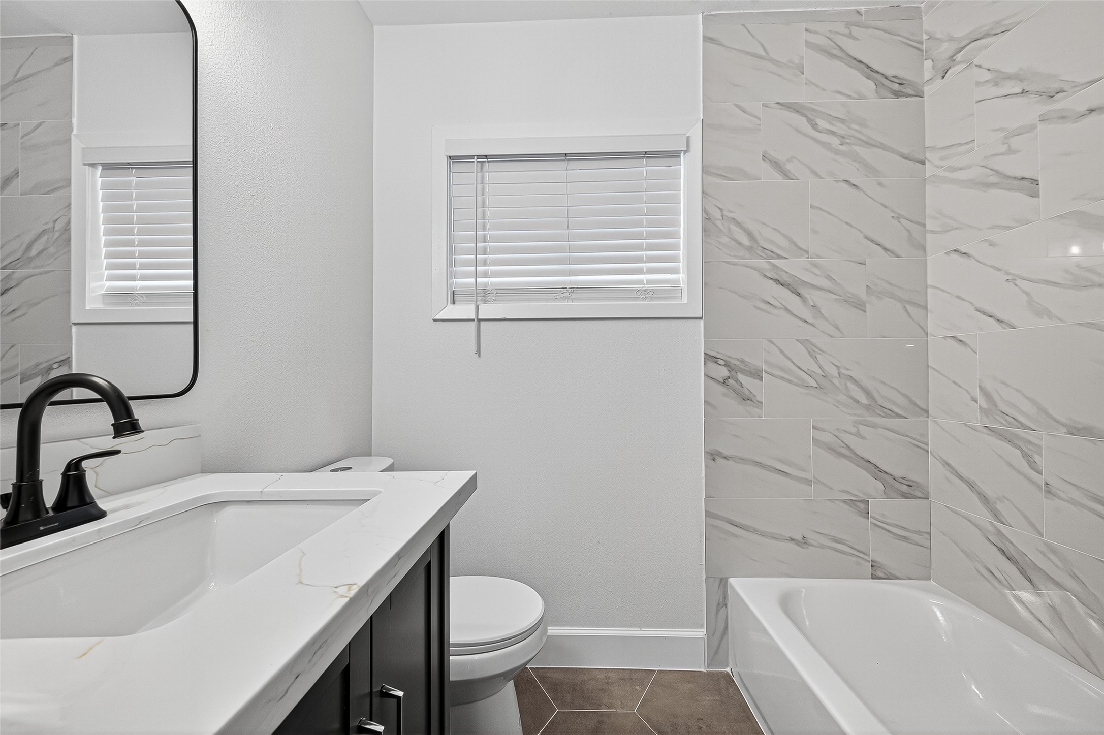 1609 North Pacific Street Conroe, TX 77301 - Photo 21 of 28 a bathroom with a sink and a tub