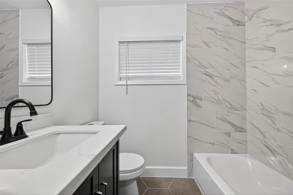 a bathroom with a sink and a tub