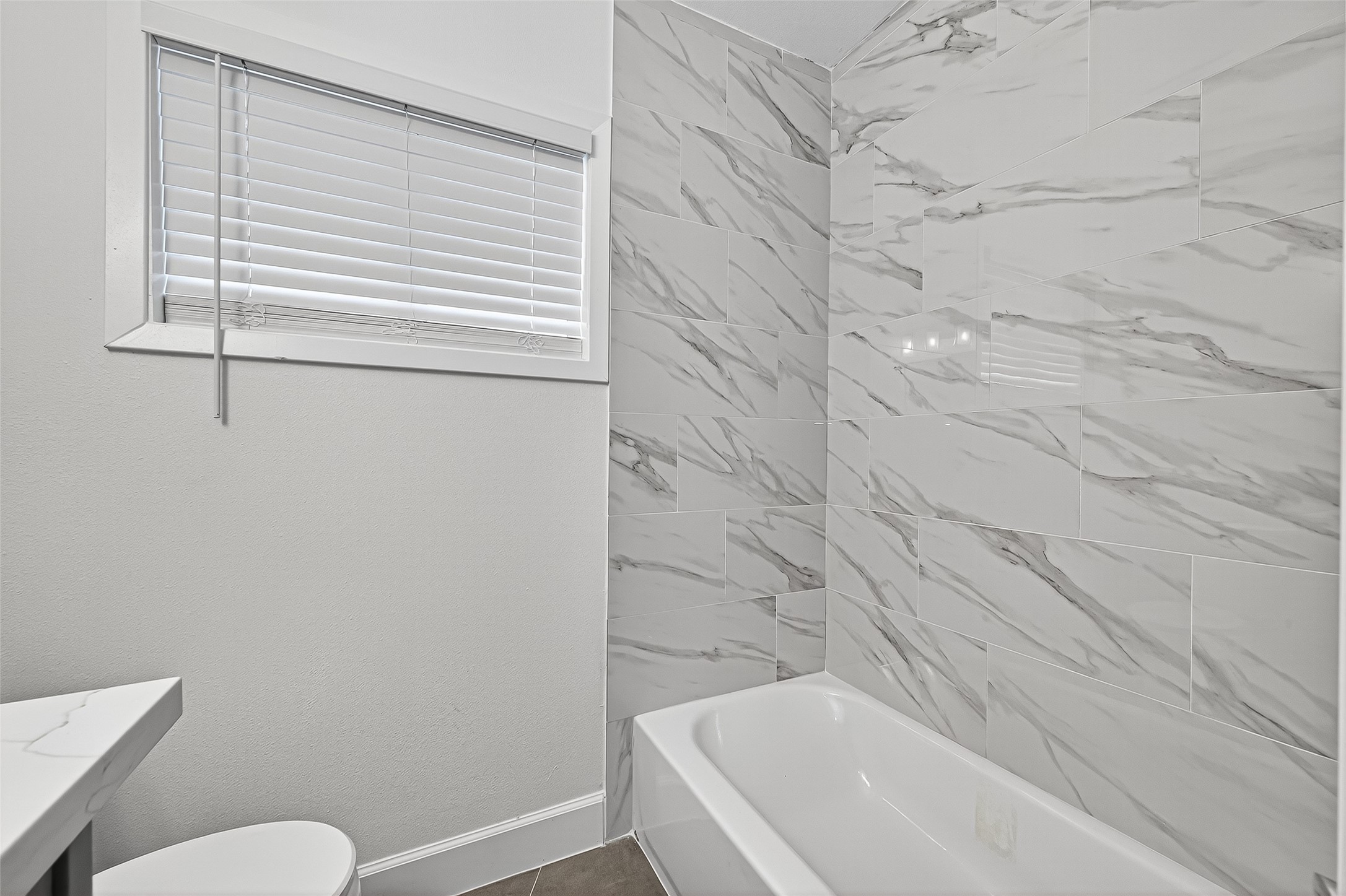 1609 North Pacific Street Conroe, TX 77301 - Photo 22 of 28 a bathroom with a sink and a toilet
