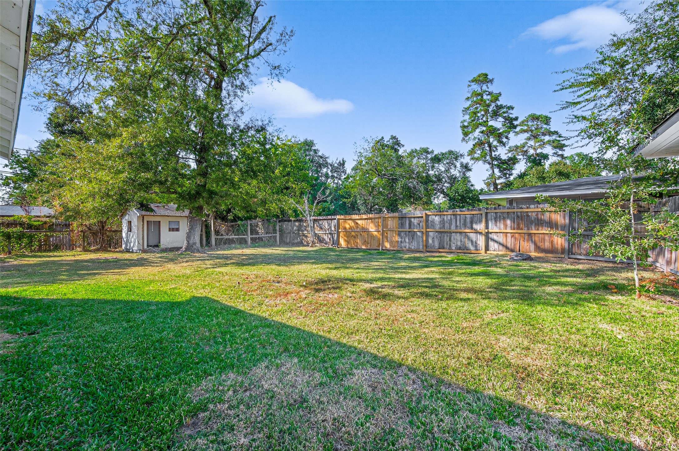 1609 North Pacific Street Conroe, TX 77301 - Photo 27 of 28 a view of a swimming pool with a garden