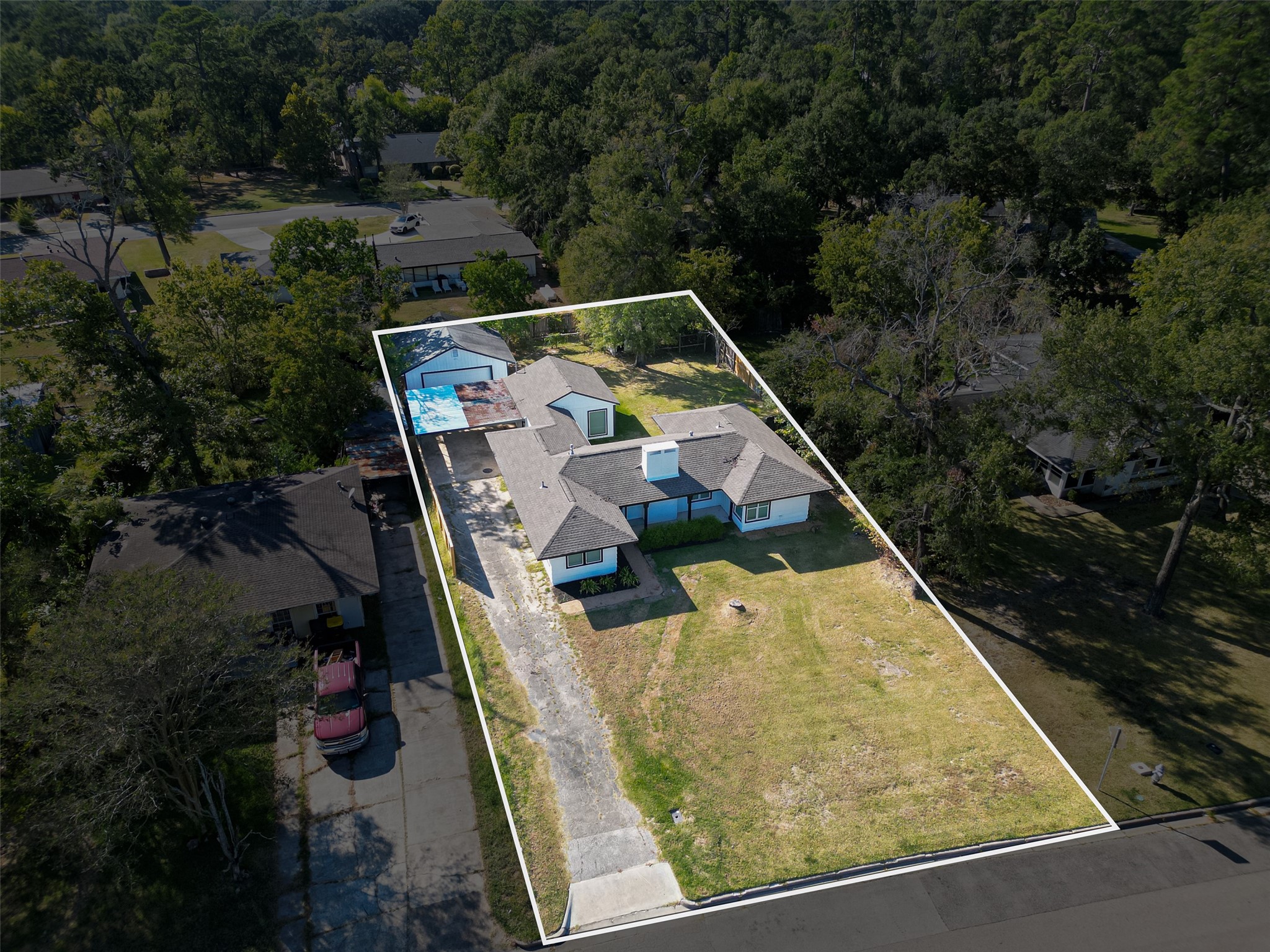 1609 North Pacific Street Conroe, TX 77301 - Photo 5 of 28 swimming pool with trees in the background