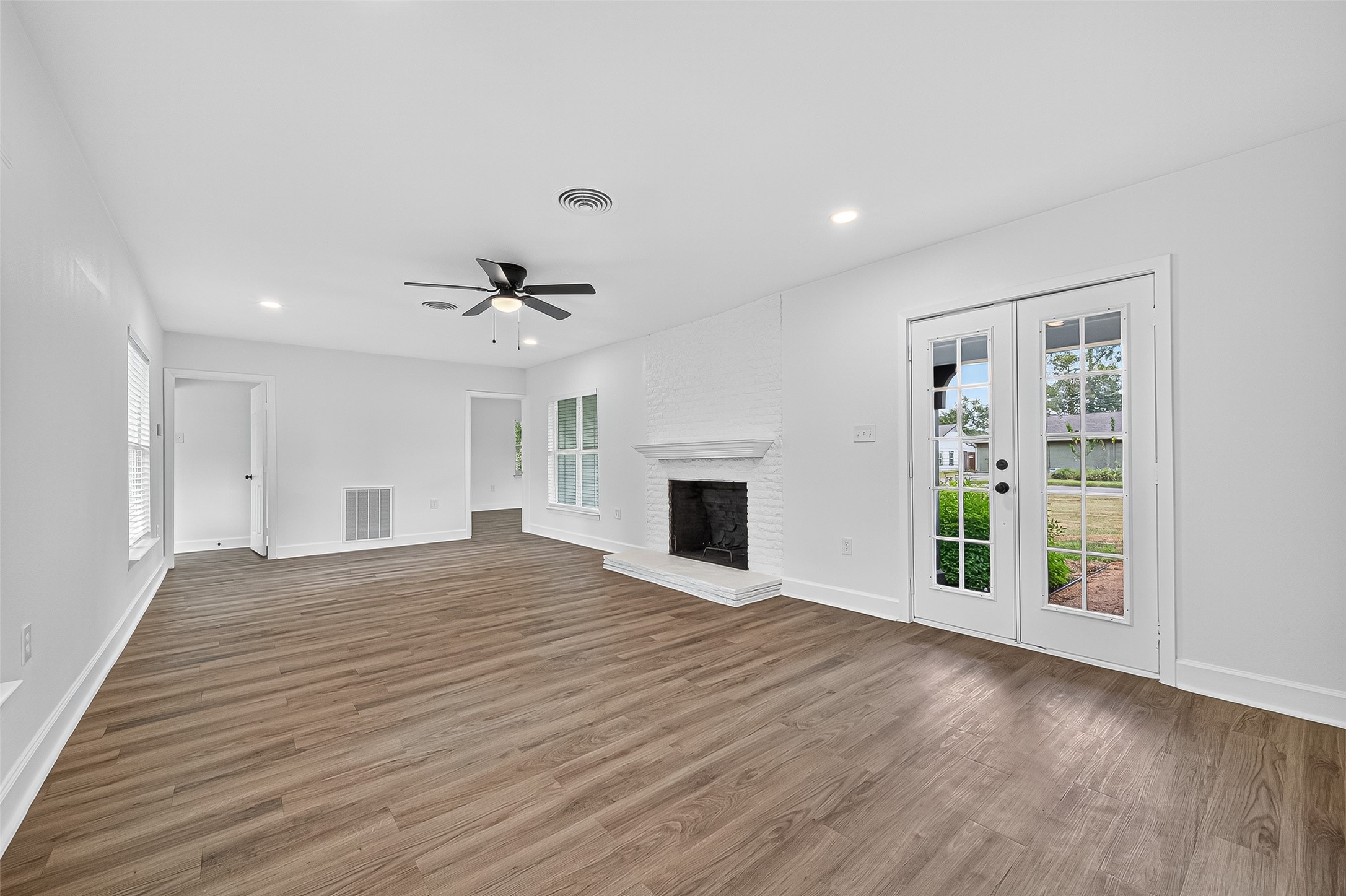 1609 North Pacific Street Conroe, TX 77301 - Photo 6 of 28 a view of an empty room with a fireplace and a window
