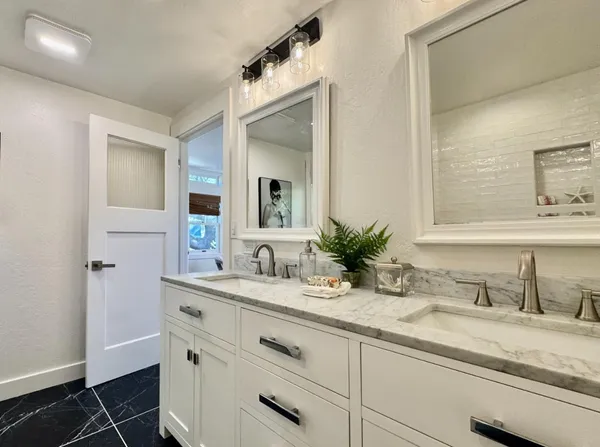 a bathroom with a sink and a mirror
