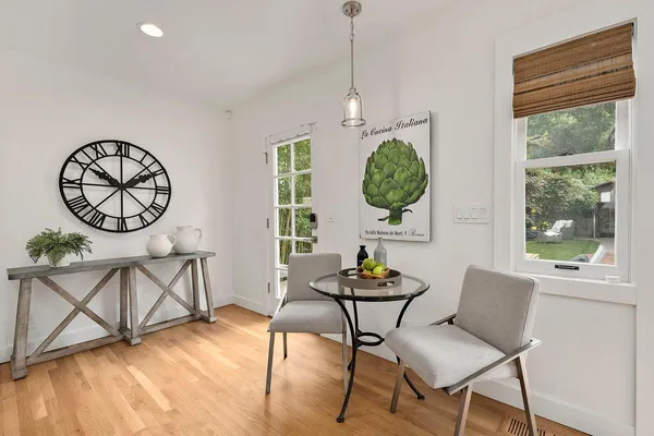 a view of a room with furniture and window