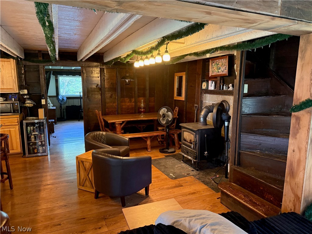 11811 Gaston Road Rogers, OH 44455 - Photo 24 of 38 Enjoy your time inside this cozy, functional, and equipped log cabin! You've already got the important utilities like electric, geo-thermal heat, a septic system installed 6 years ago, and private well water.