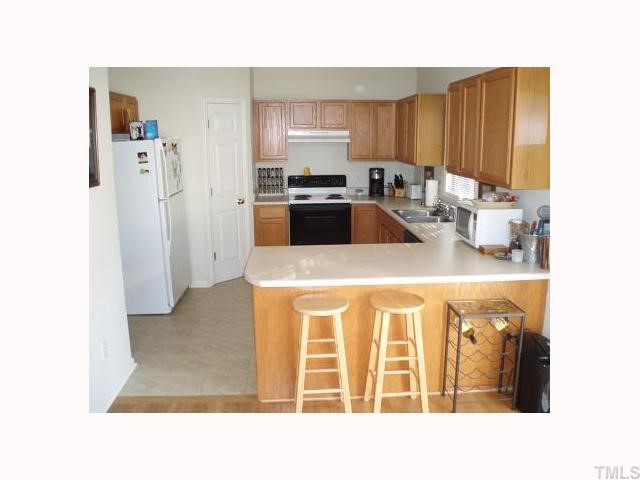 2800 Lower Dryer Falls Raleigh, NC 27615 - Photo 6 of 10 Open Eat-in Kitchen has brand new tile floors