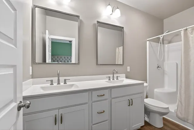 an empty room with closet and wooden floor