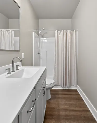 a view of a patio with table and chairs with wooden fence