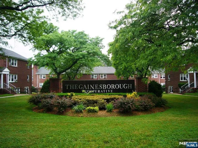 a view of a sign board and yard