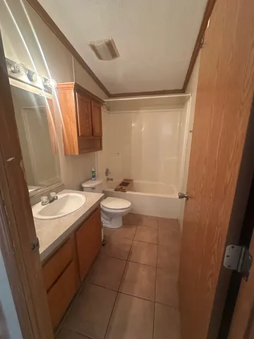 a bathroom with sink and mirror