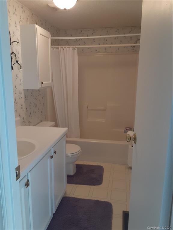511 Daniels Ridge Road Taylorsville, NC 28681 - Photo 13 of 28 a bathroom with a sink a toilet and shower