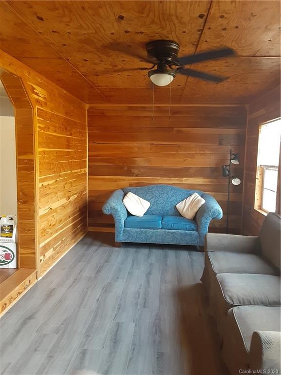 511 Daniels Ridge Road Taylorsville, NC 28681 - Photo 18 of 28 a view of a livingroom with furniture and wooden floor