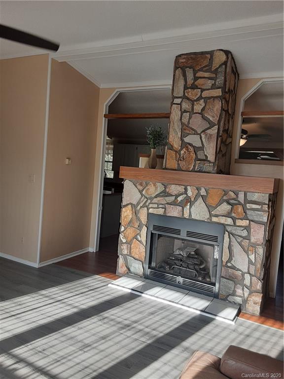 511 Daniels Ridge Road Taylorsville, NC 28681 - Photo 19 of 28 a view of fireplace and wooden floor