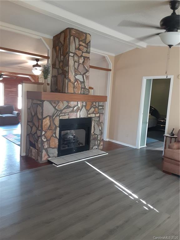 511 Daniels Ridge Road Taylorsville, NC 28681 - Photo 20 of 28 a living room with furniture and a fireplace