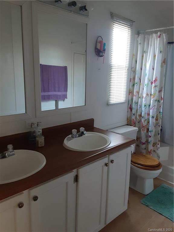 511 Daniels Ridge Road Taylorsville, NC 28681 - Photo 23 of 28 a bathroom with double sink and a mirror
