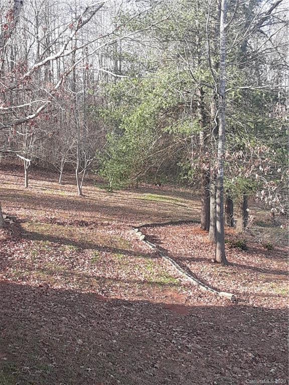 511 Daniels Ridge Road Taylorsville, NC 28681 - Photo 5 of 28 a backyard of a house with lots of green space