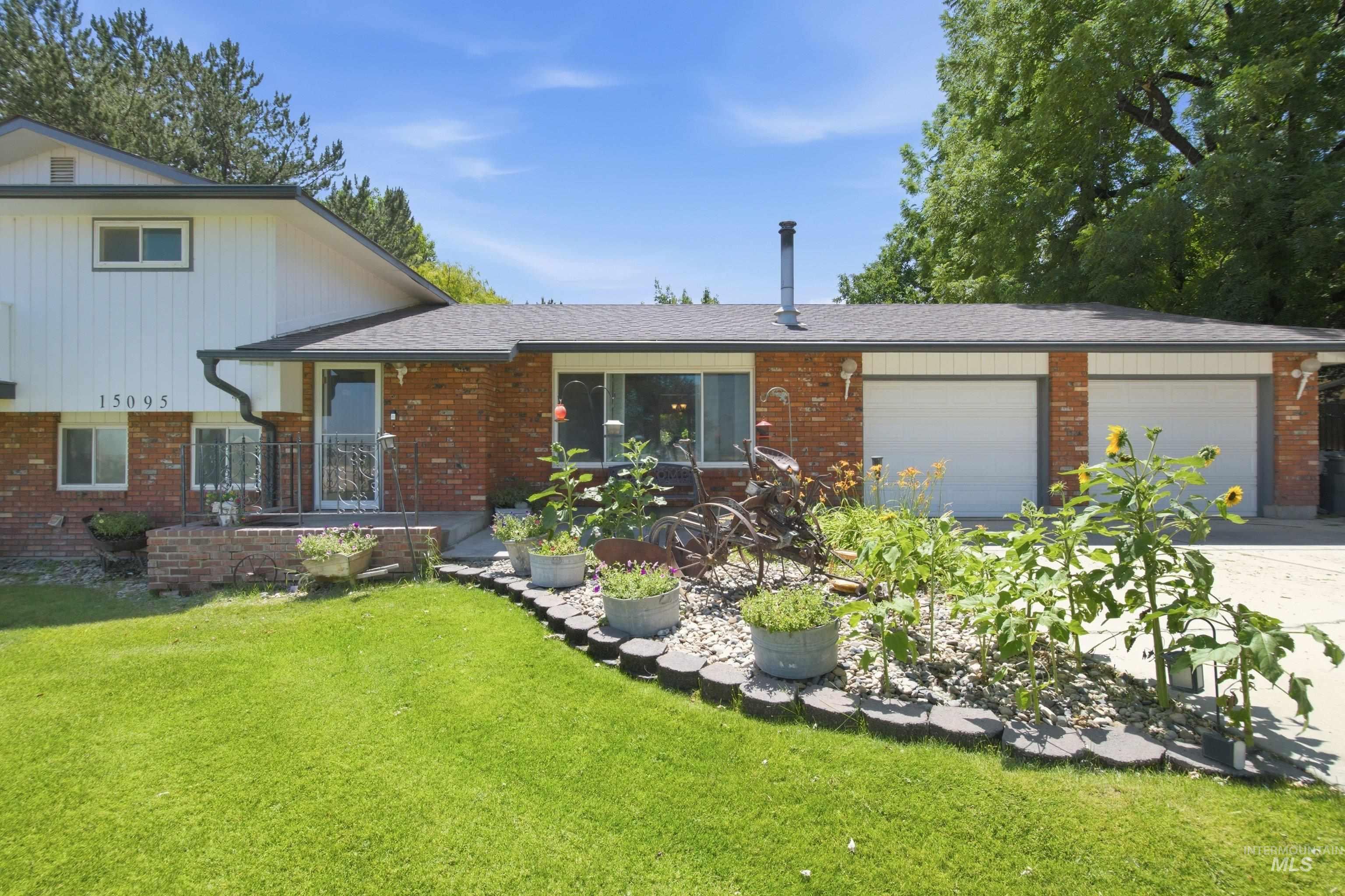 15095 David Street Caldwell, ID 83607 - Photo 3 of 39 Brick and white siding exterior with a dark shingle roof
