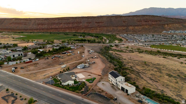 2591 East Washington Dam Road Washington, UT 84780 - Photo 4 of 67 Aerial perspective showcasing a sprawling property with two distinct structures and a swimming pool