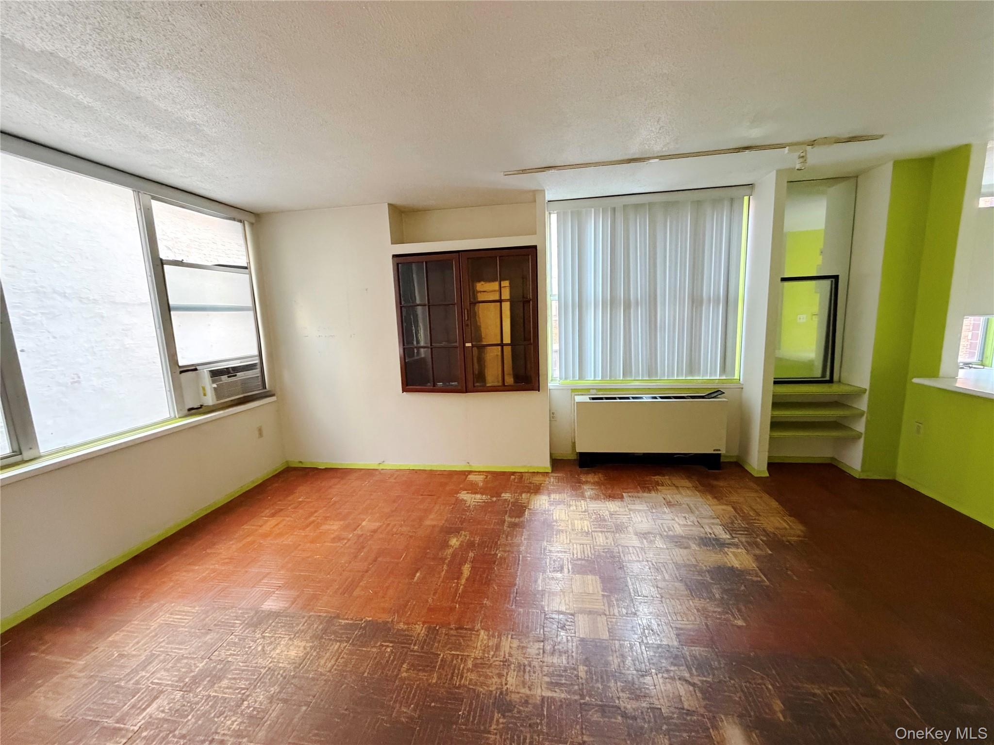 520 West 112th Street, Unit 4B Manhattan, NY 10025 - Photo 4 of 11 Unfurnished room with a textured ceiling