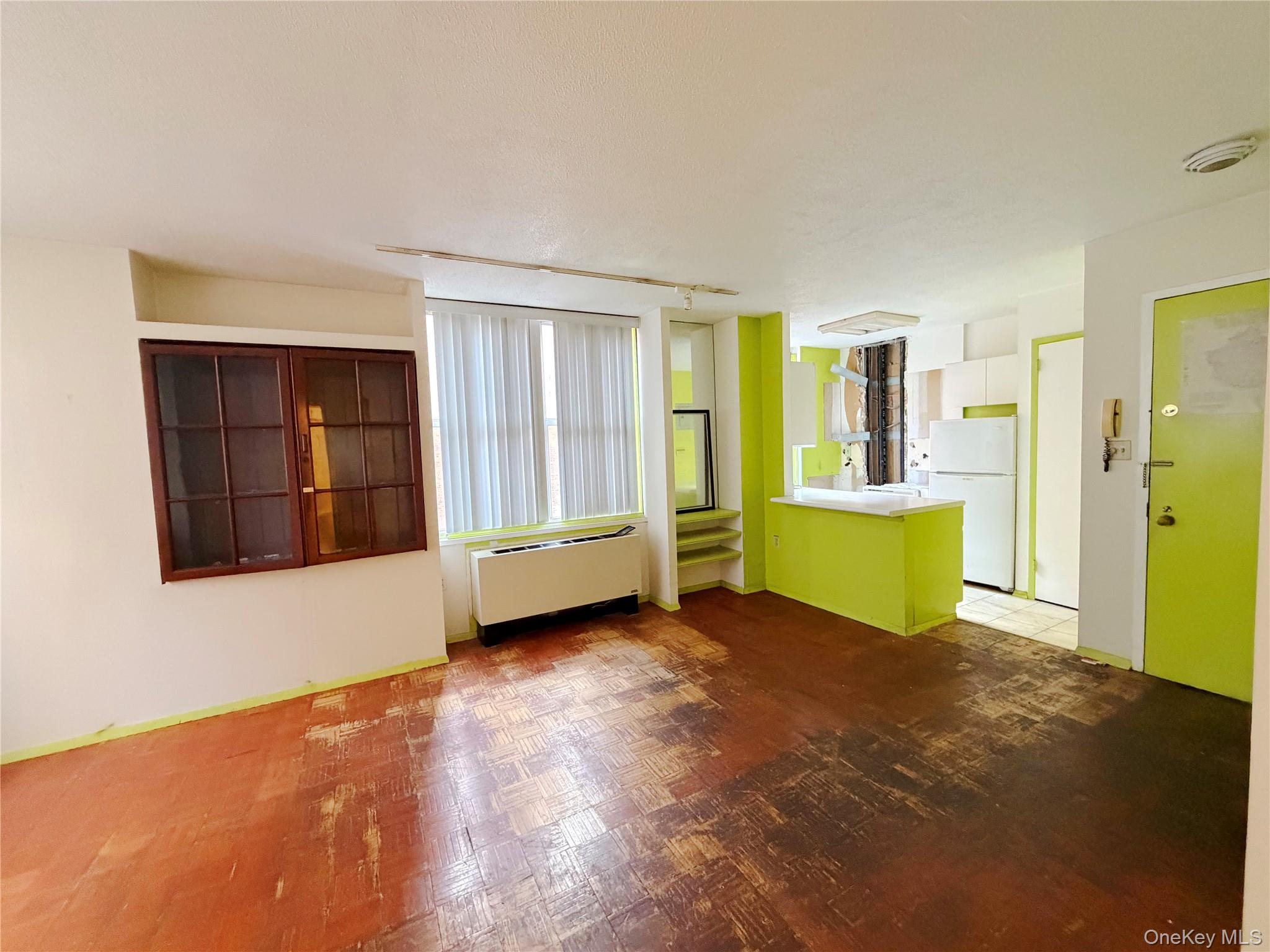 520 West 112th Street, Unit 4B Manhattan, NY 10025 - Photo 8 of 11 Unfurnished room with rail lighting