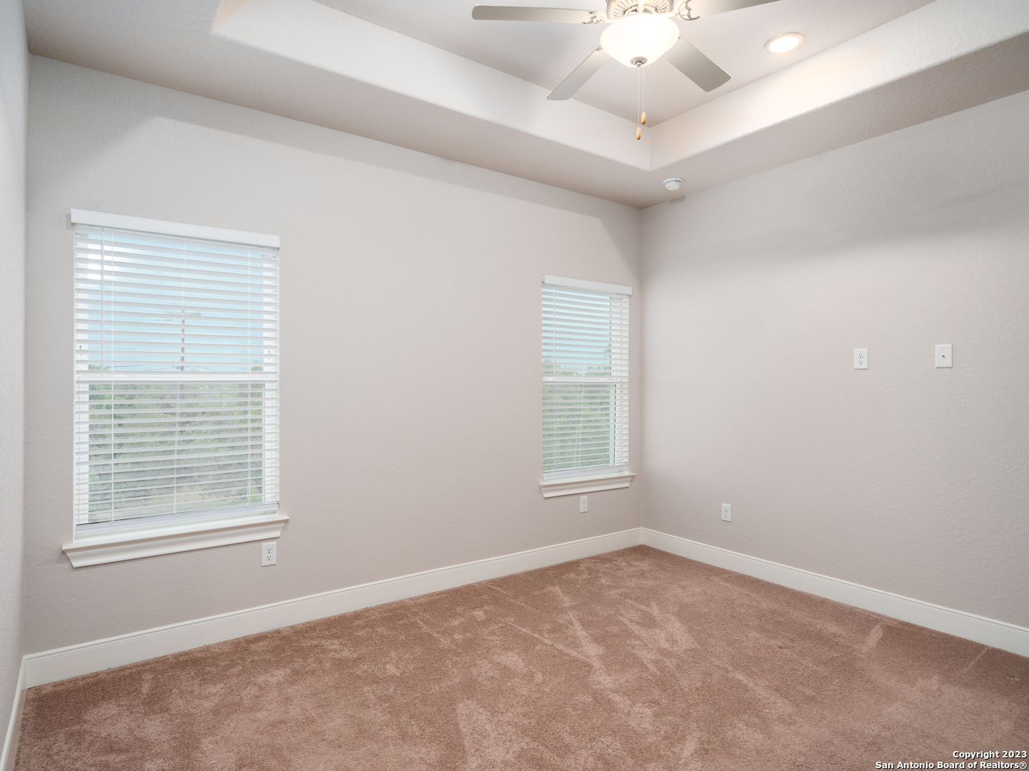 361 High Drive, Unit A Spring Branch, TX 78070 - Photo 12 of 20 an empty room with a window and a ceiling fan