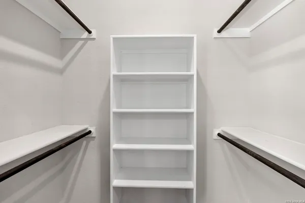 a view of an empty walk in closet