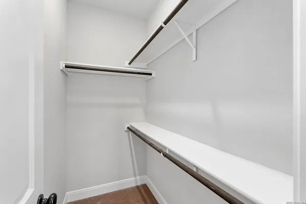 a view of small space with racks on the wall