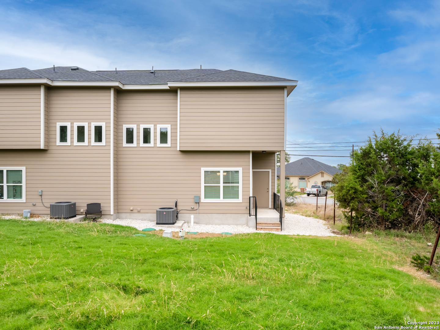 361 High Drive, Unit A Spring Branch, TX 78070 - Photo 20 of 20 a front view of a house with a yard