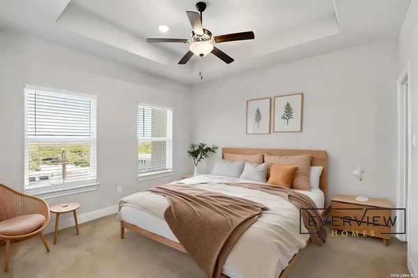 a bedroom with a bed and window