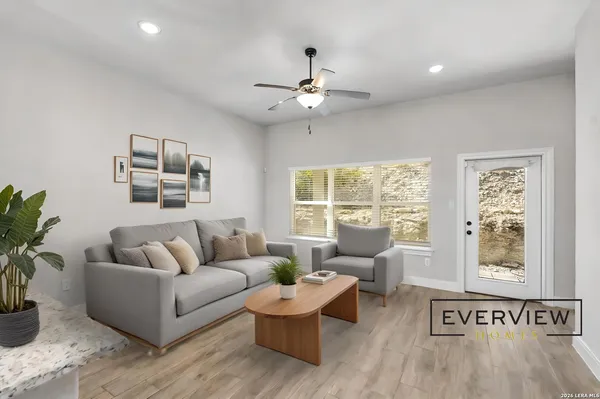a living room with furniture and a window