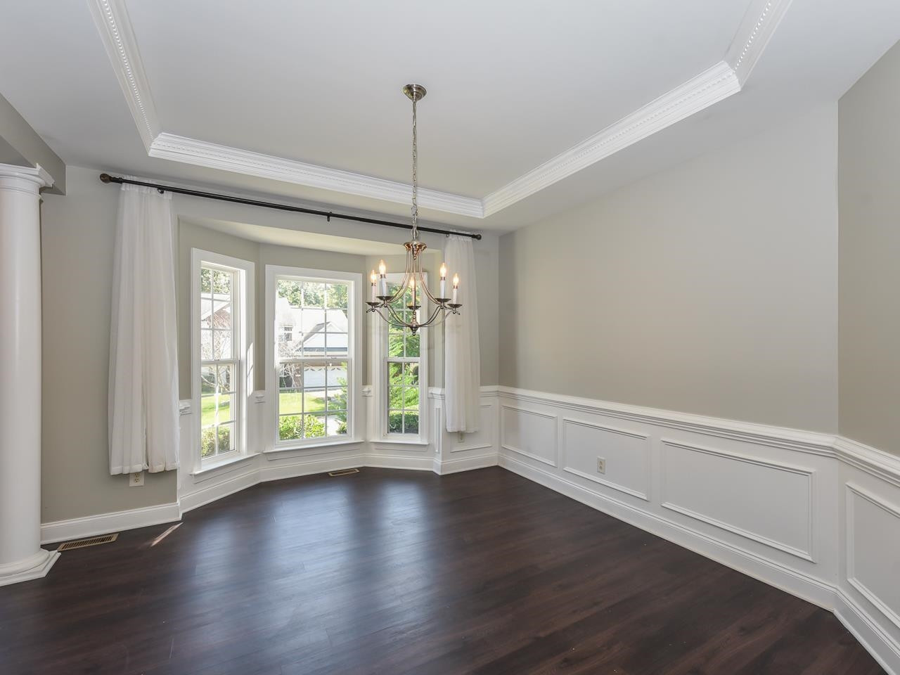 200 Quarryrock Road Holly Springs, NC 27540 - Photo 12 of 39 a view of an empty room with wooden floor and a window