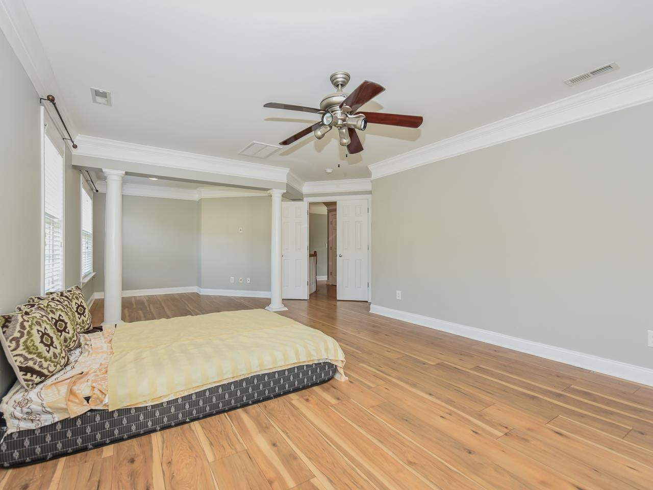 200 Quarryrock Road Holly Springs, NC 27540 - Photo 22 of 39 a bedroom with a bed and a chandelier