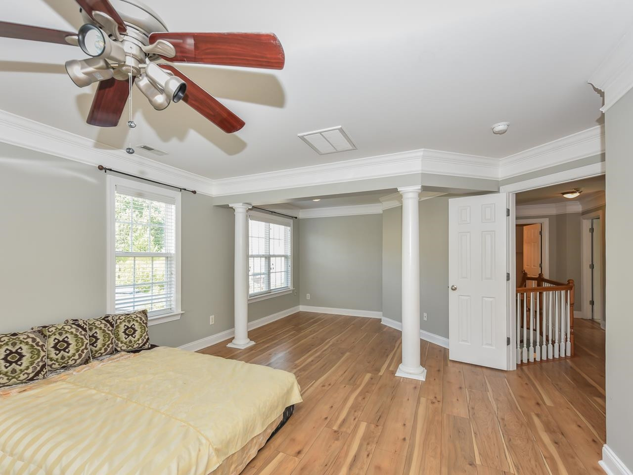 200 Quarryrock Road Holly Springs, NC 27540 - Photo 24 of 39 a bedroom with a bed and a chandelier